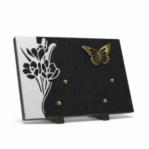Plaque granit motif fleur bronze papillon