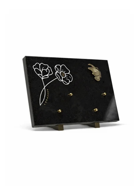 Plaque granit noir motif fleur bronze papillon